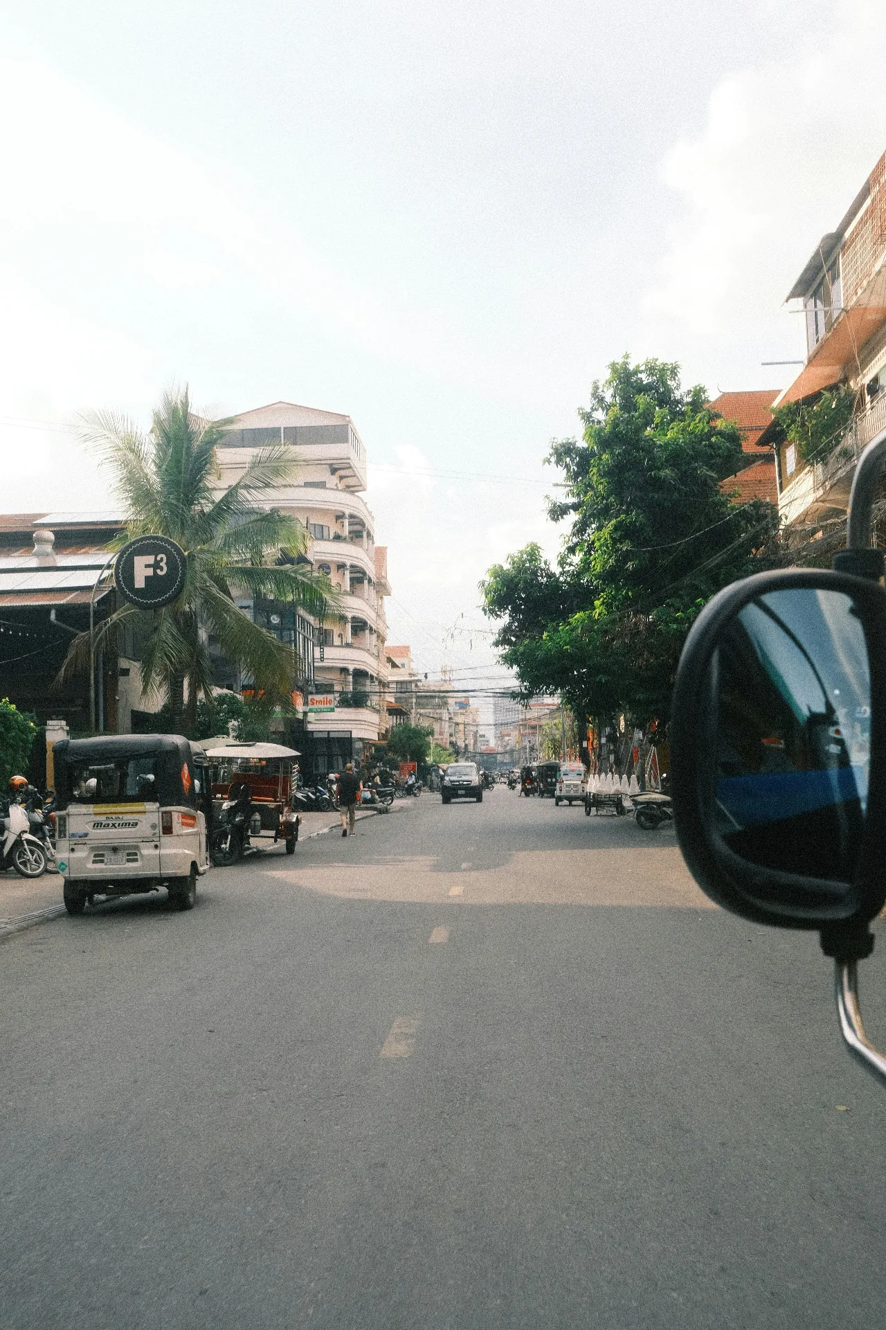 City streets — Phnom Penh, tuk-tuks and morning traffic, property market research